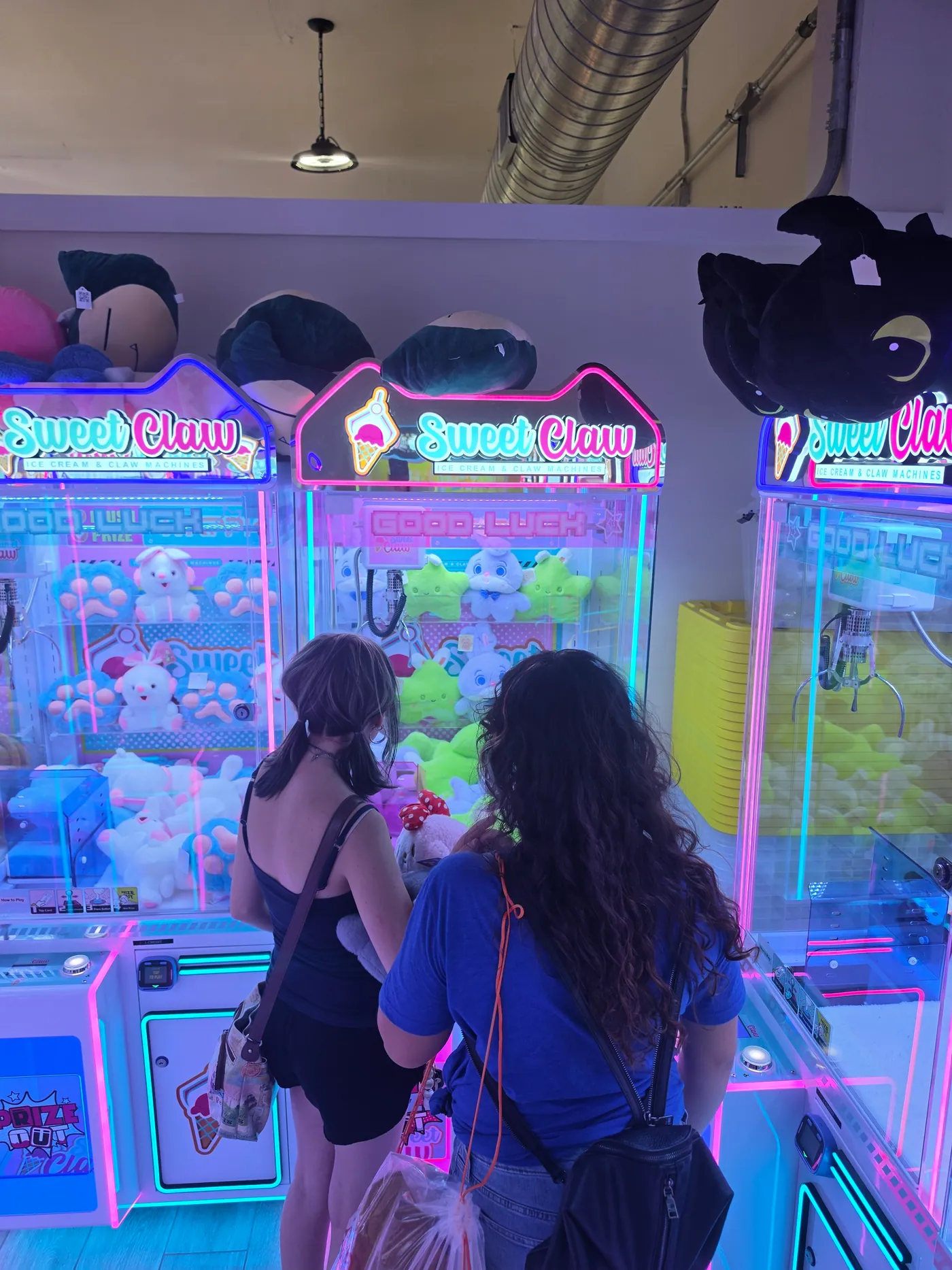 Claw machines packed with colorful plush toys