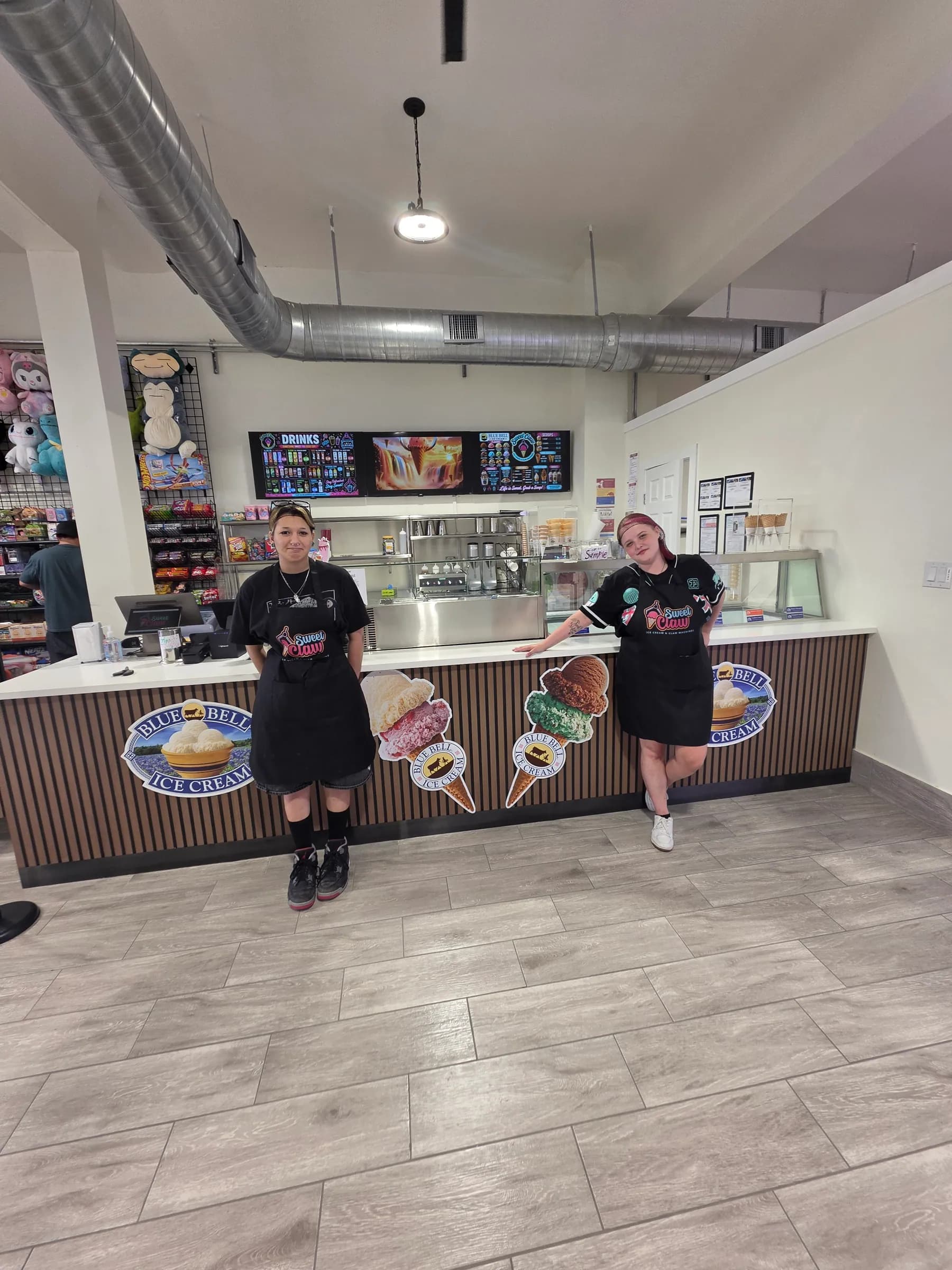 The Sweet Claw service counter with the menu boards above it
