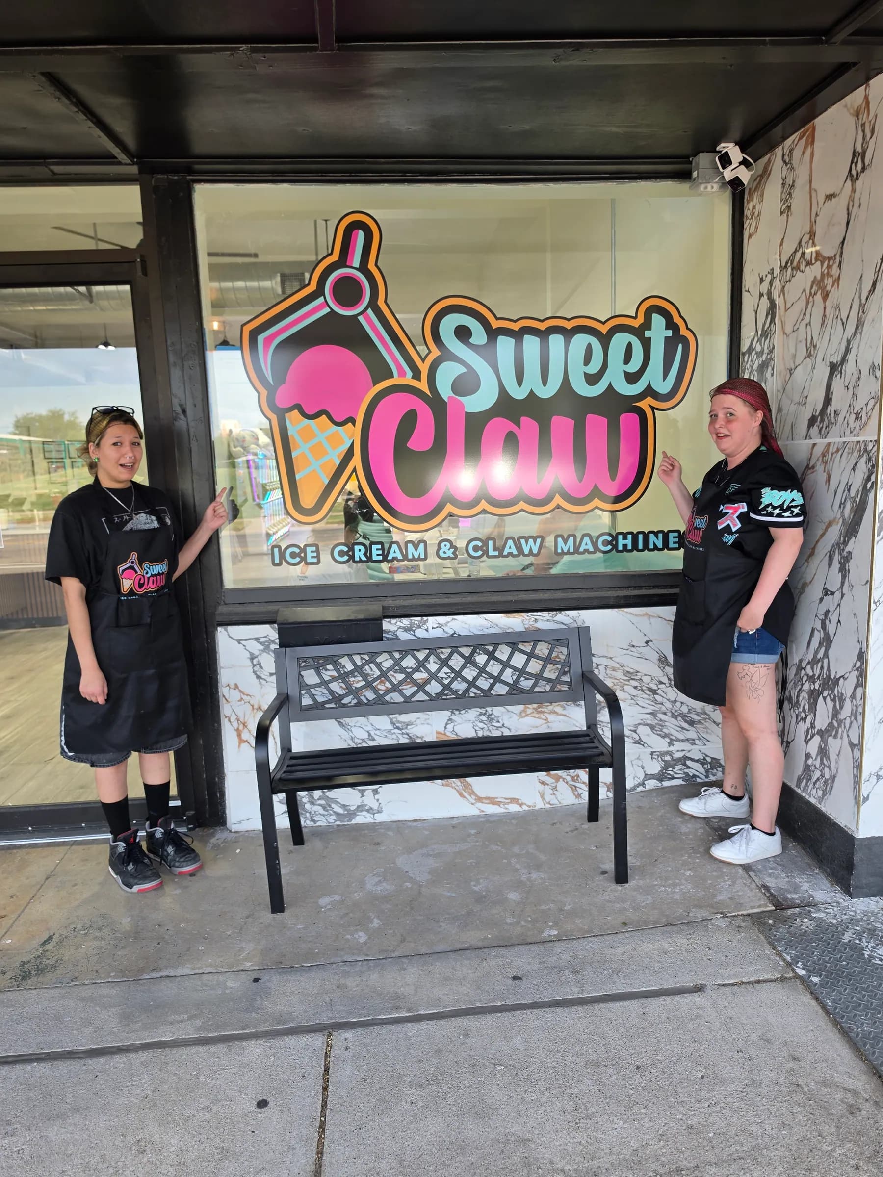 The Sweet Claw shop window with the logo on the glass